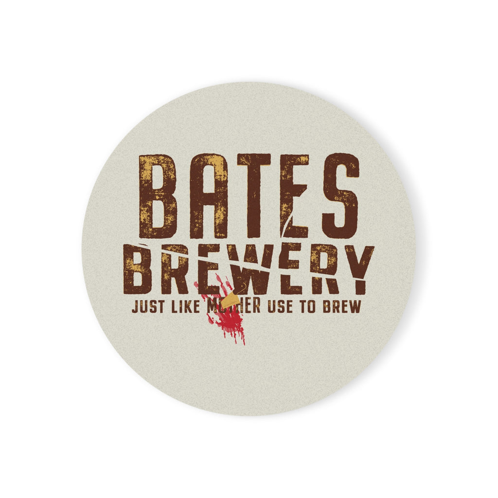 A round ceramic coaster featuring the Bates Brewery logo and tagline “Beer Like Mother Used to Brew”, displayed on a wooden table.