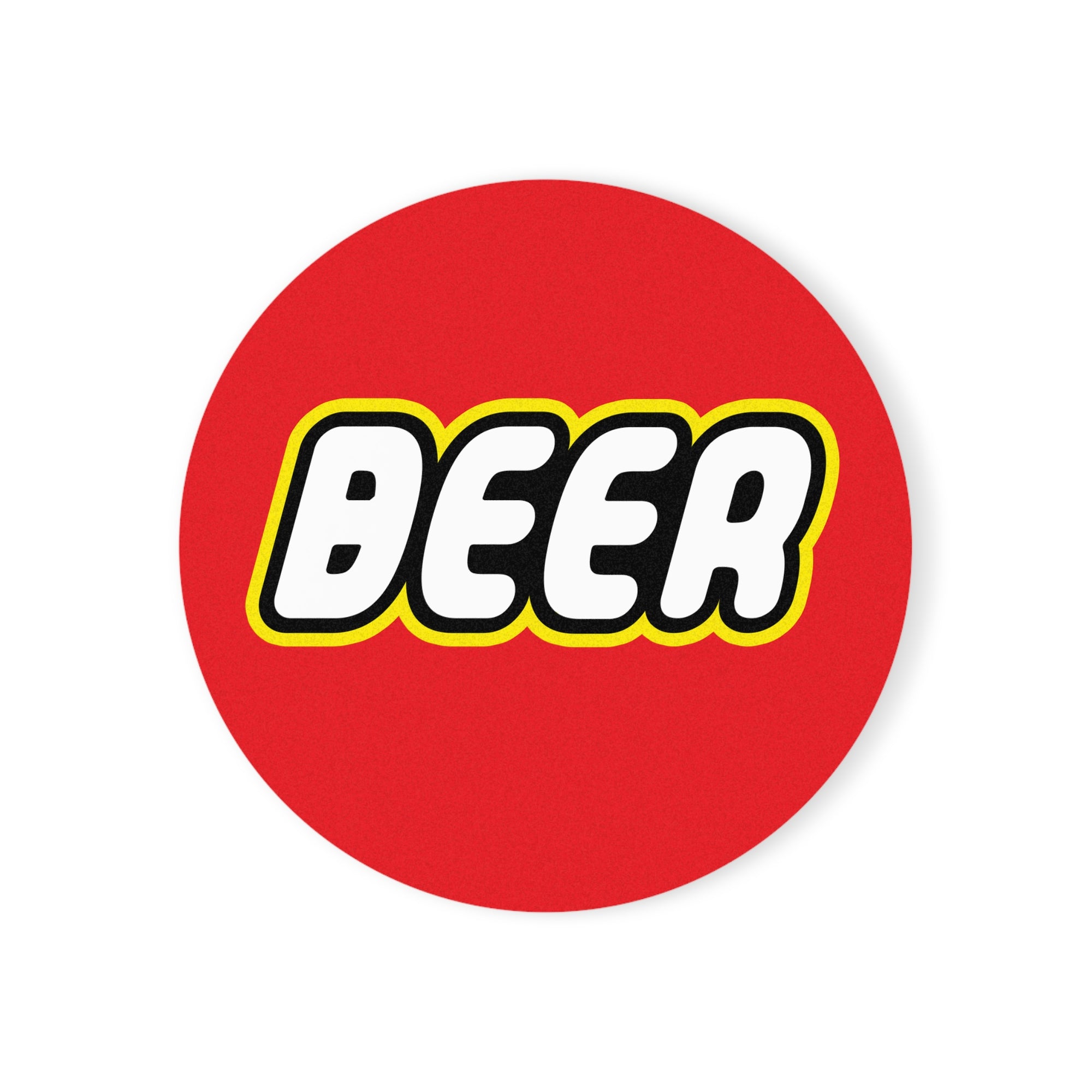 A round ceramic coaster featuring a colorful building block-inspired design, perfect for beer lovers.