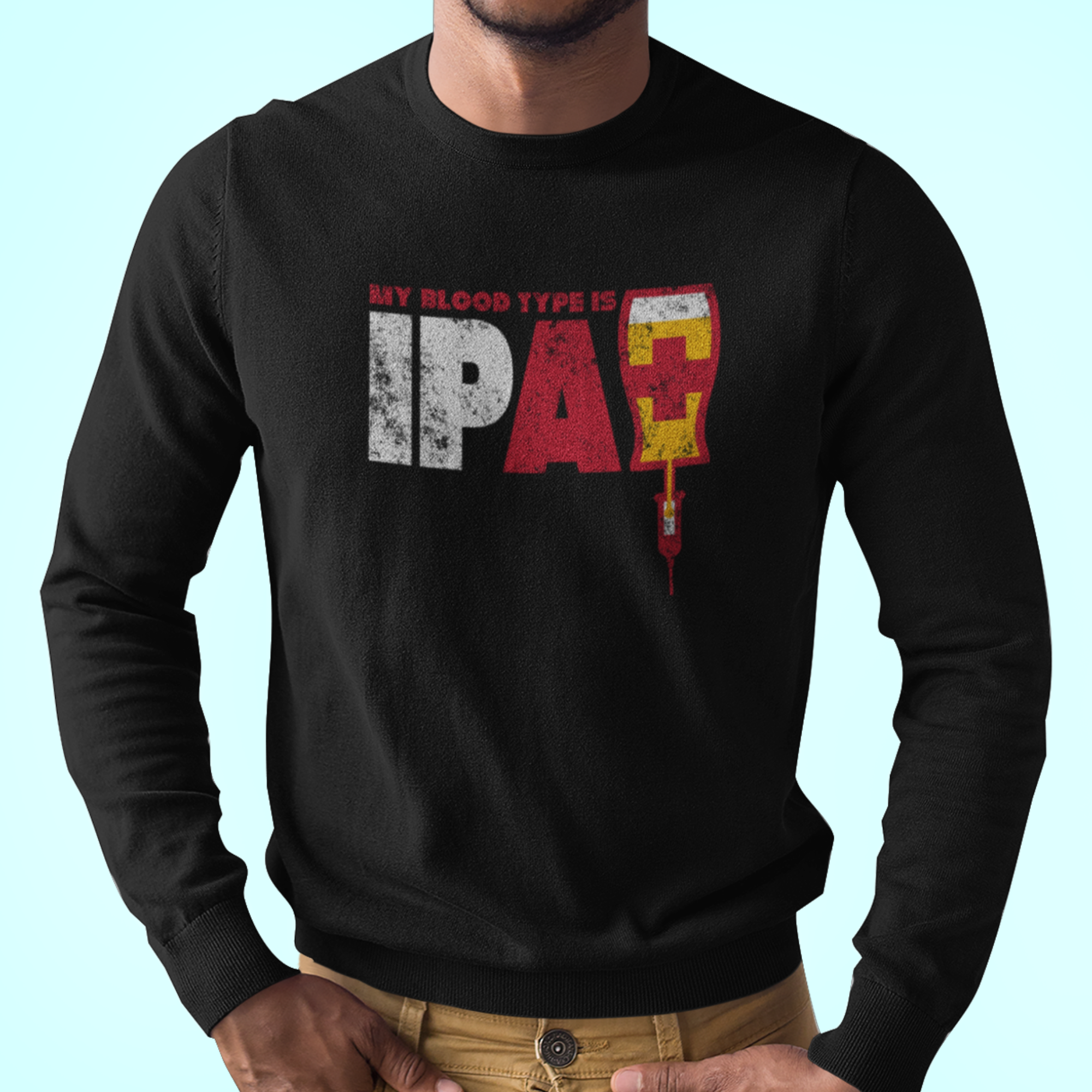 Black long-sleeve tee with My Blood Type Is IPA+ text and IV-bag pint graphic