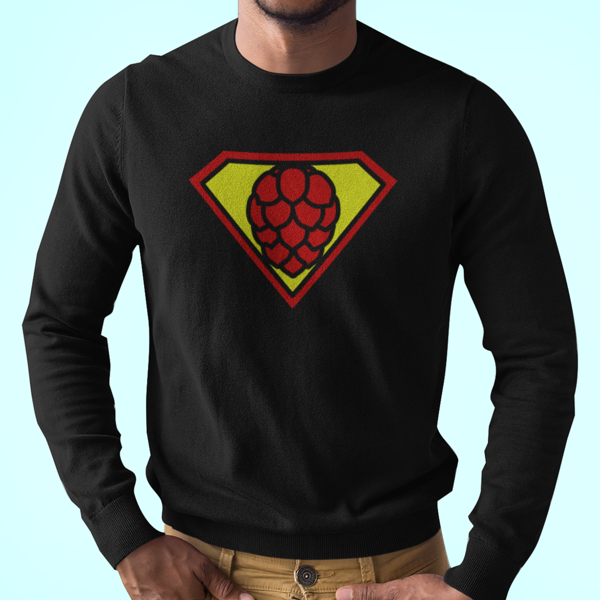 Black ringspun cotton shirt featuring red hop-cone in yellow superhero shield