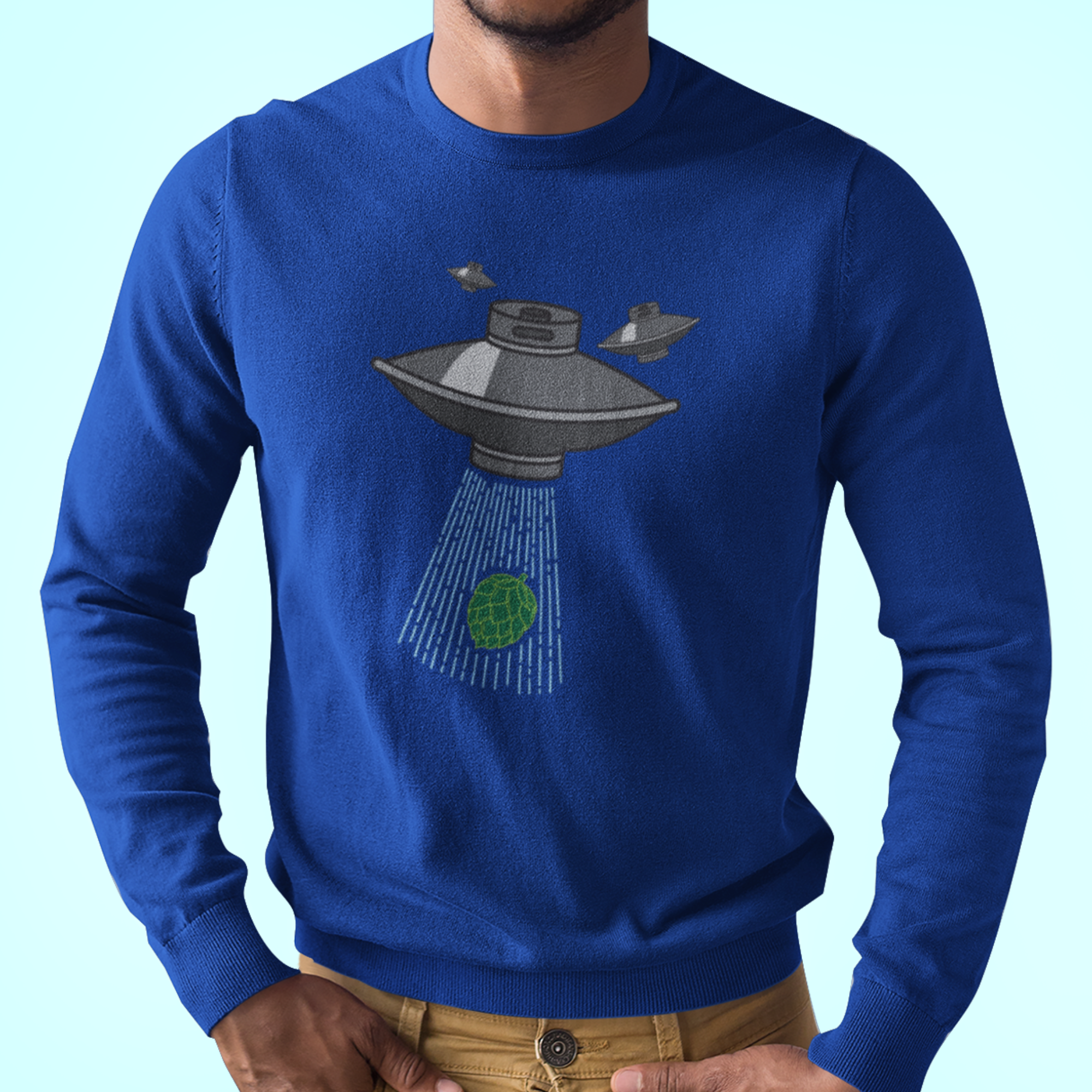 Blue long-sleeve t-shirt with flying saucer beaming up green hop cone