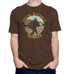 Brown t-shirt with Bigfoot holding a beer mug and text Social Distance Drinker