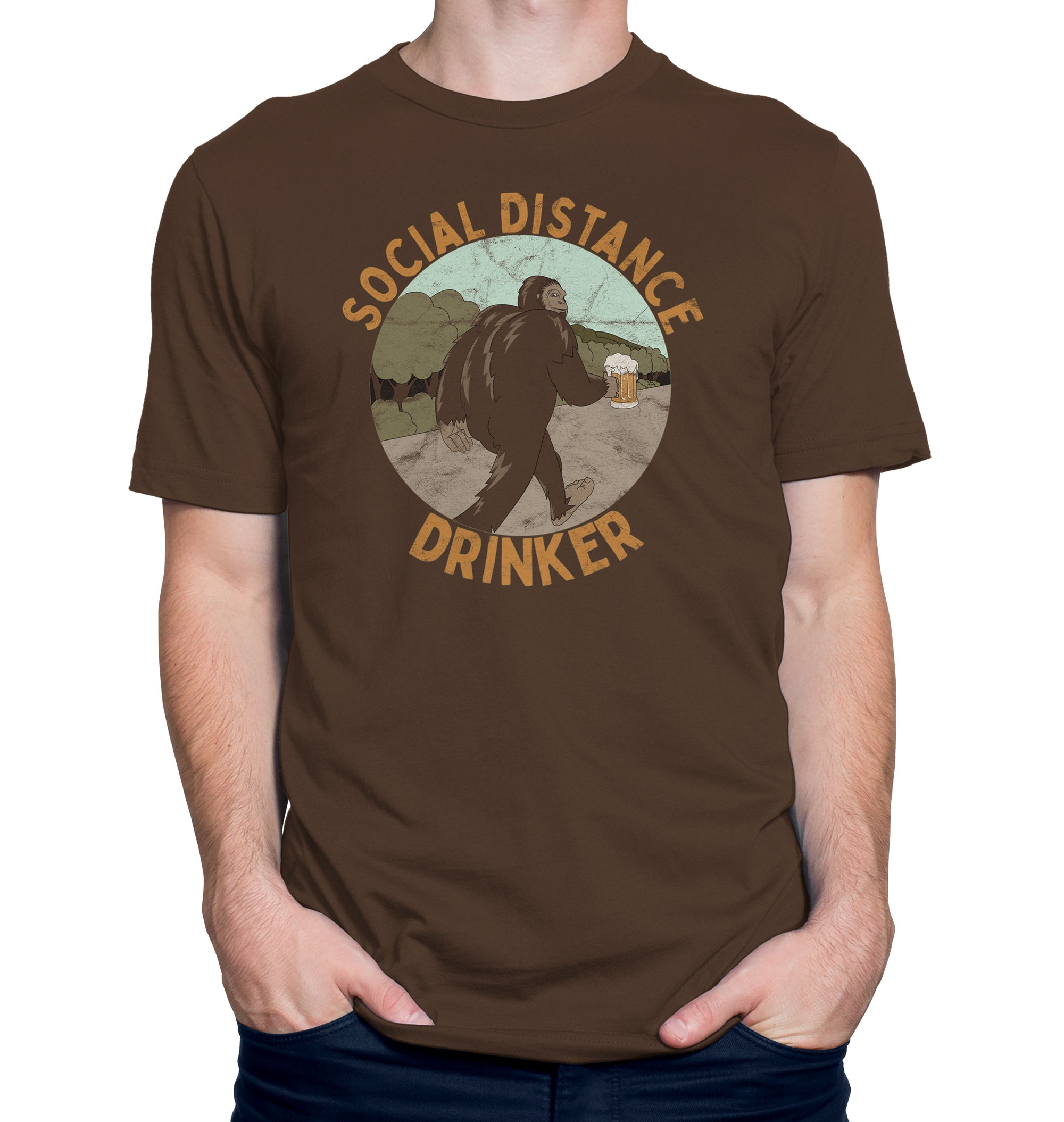Brown t-shirt with Bigfoot holding a beer mug and text Social Distance Drinker