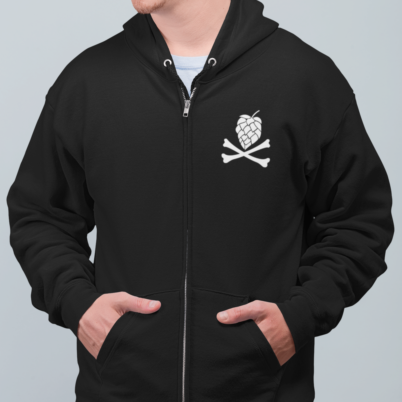 Front view of zip-up hoodie featuring oversized white hop skull and crossbones