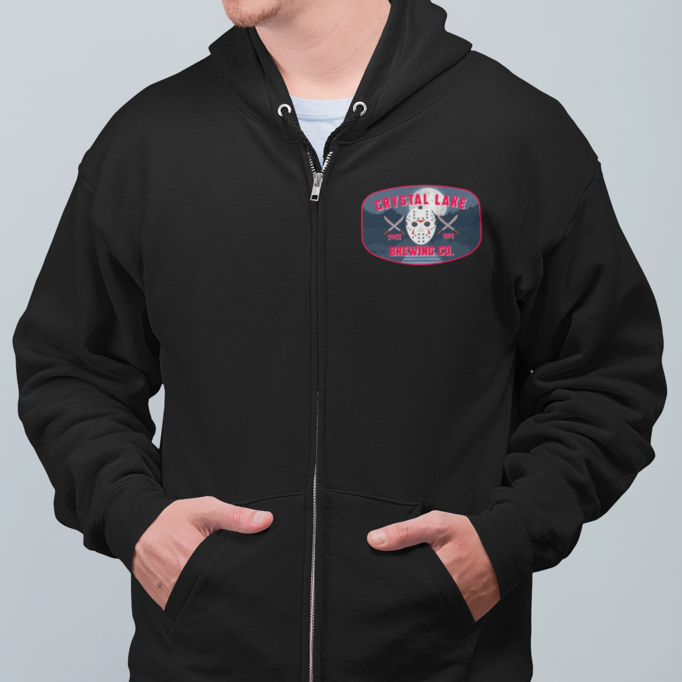 Black zip-up hoodie with hockey mask and bloody knife design