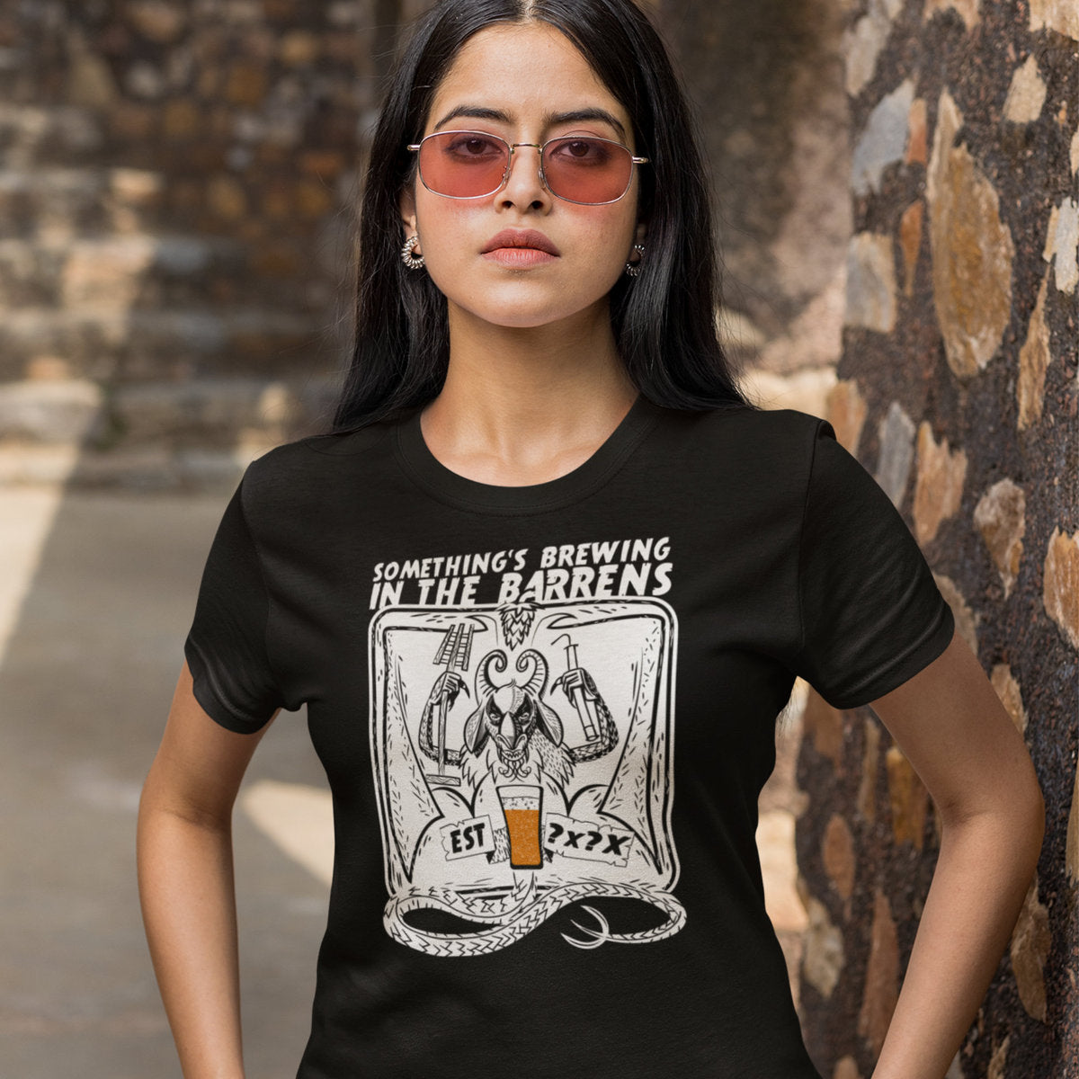 Devil graphic holding frothy IPA on women's black tee