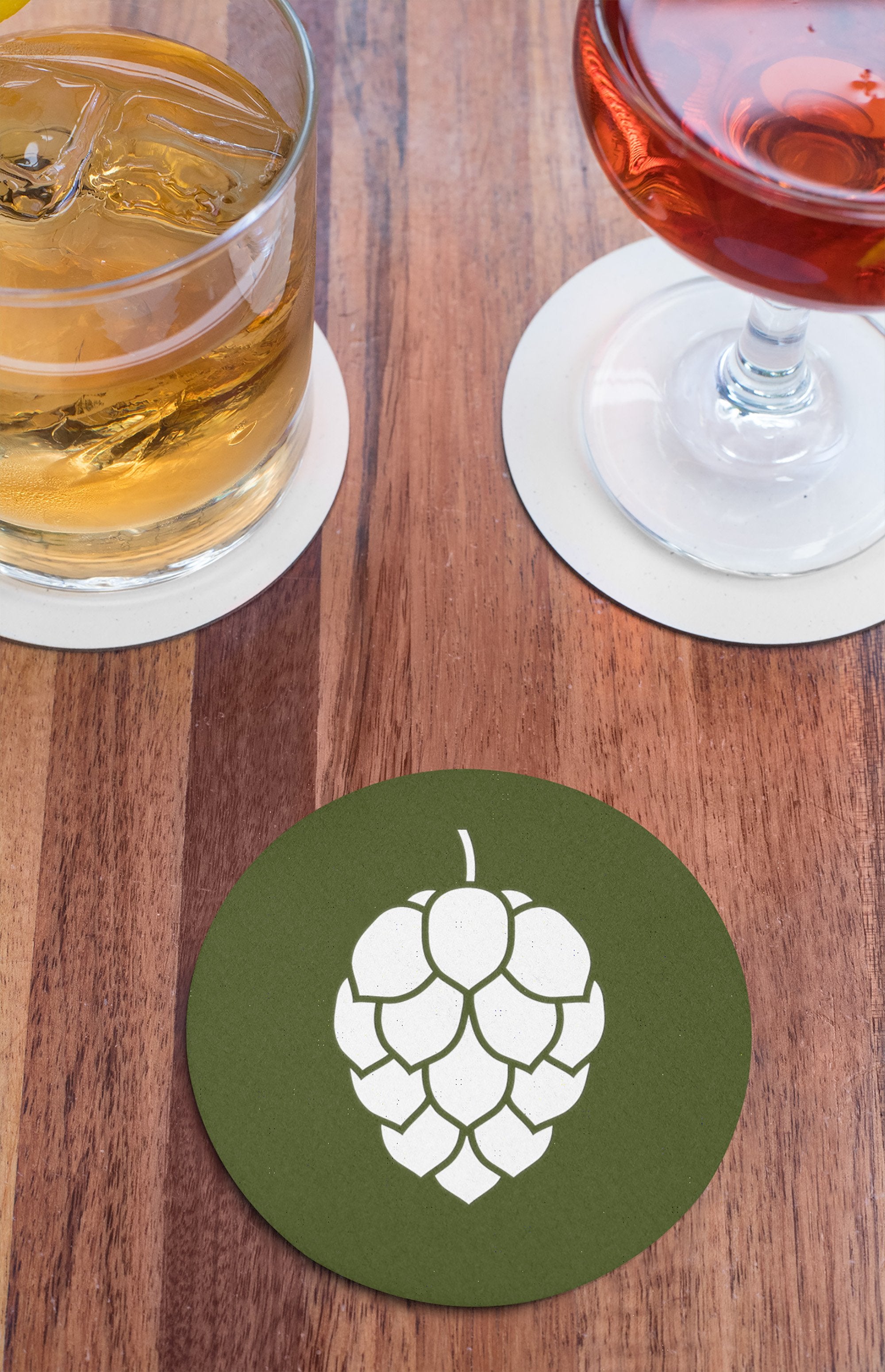 Durable beer coaster in black, green, or red with hop icon