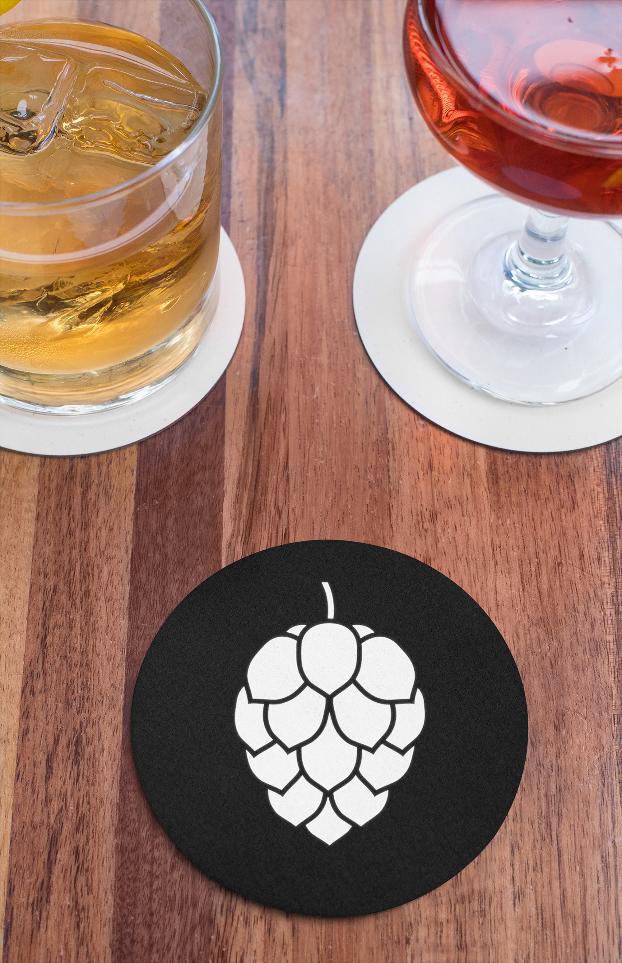 Round moisture-resistant coaster with hop design