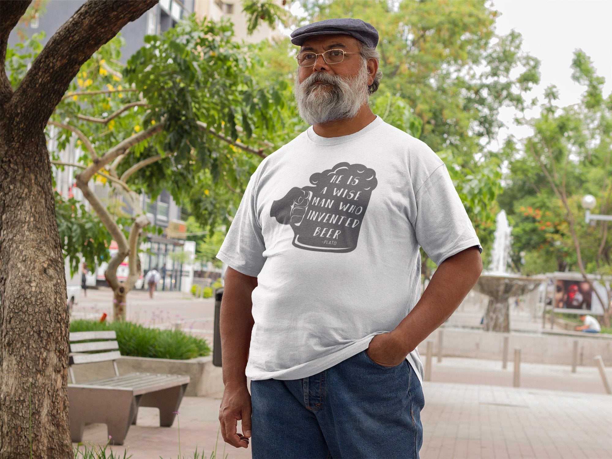 White cotton t-shirt with green text reading Plato invented beer quote